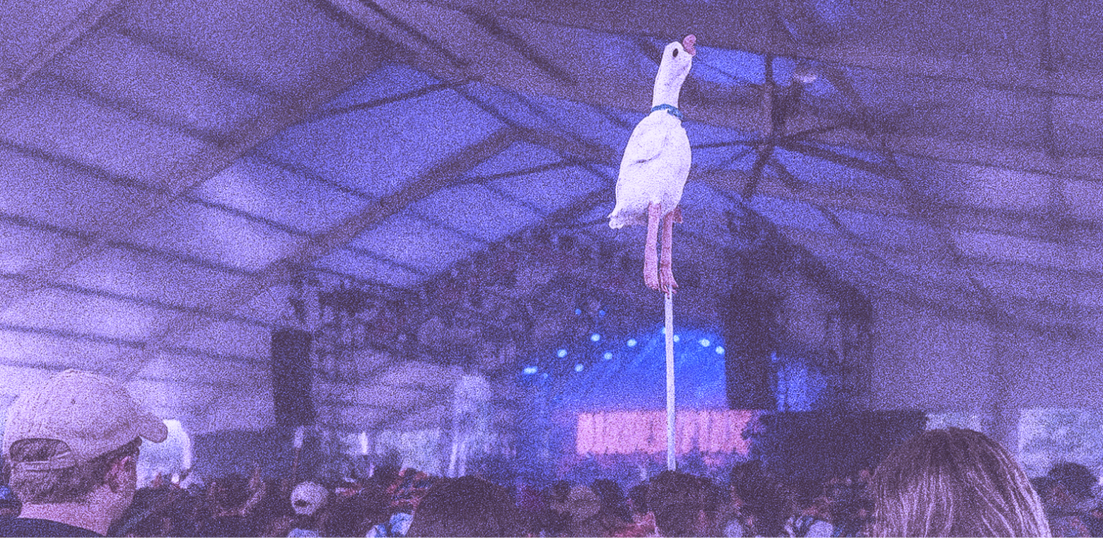 Festival totem glowing in blue and purple light
